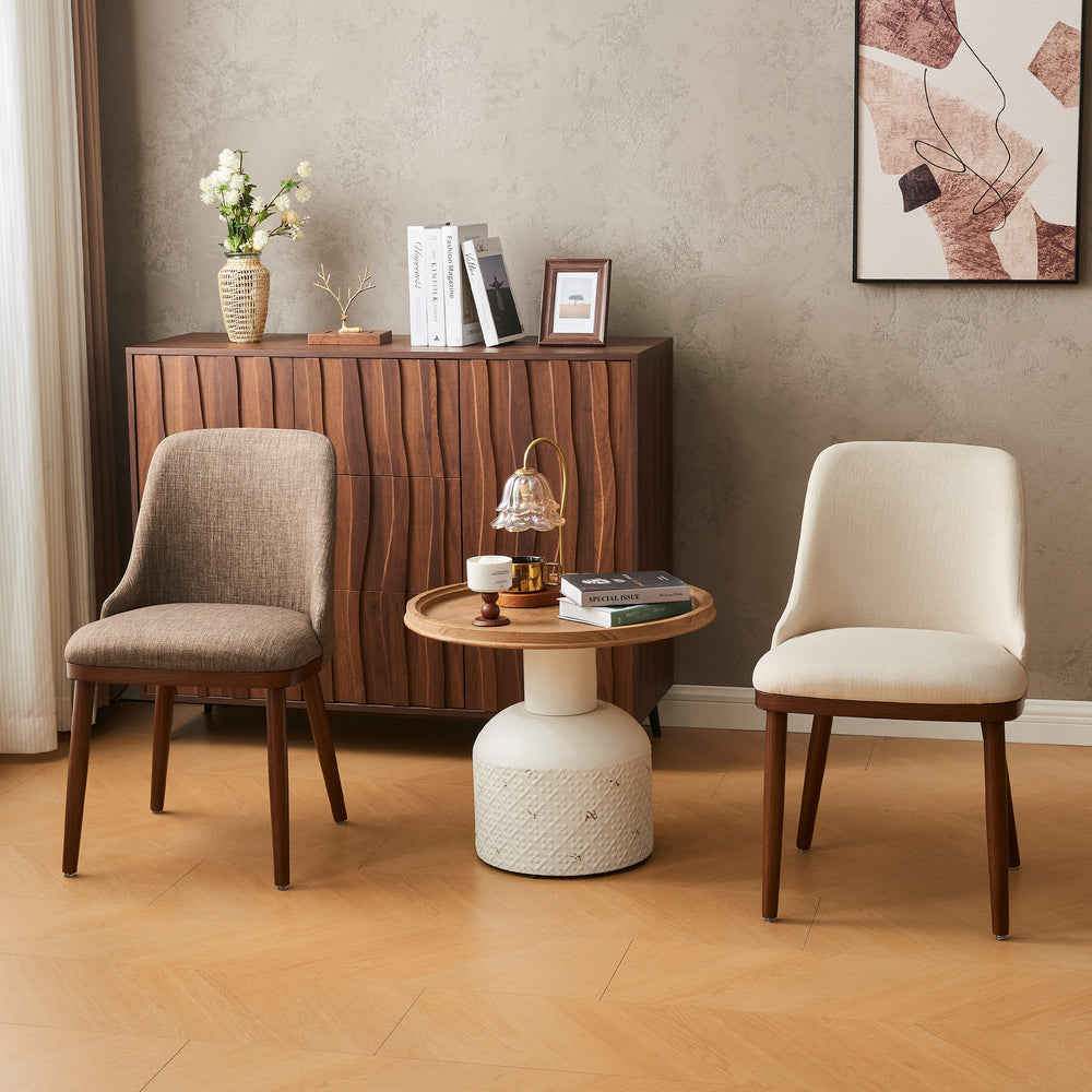 Pair of Modern Upholstered Dining Chairs in brown and cream fabric in a warm styled room