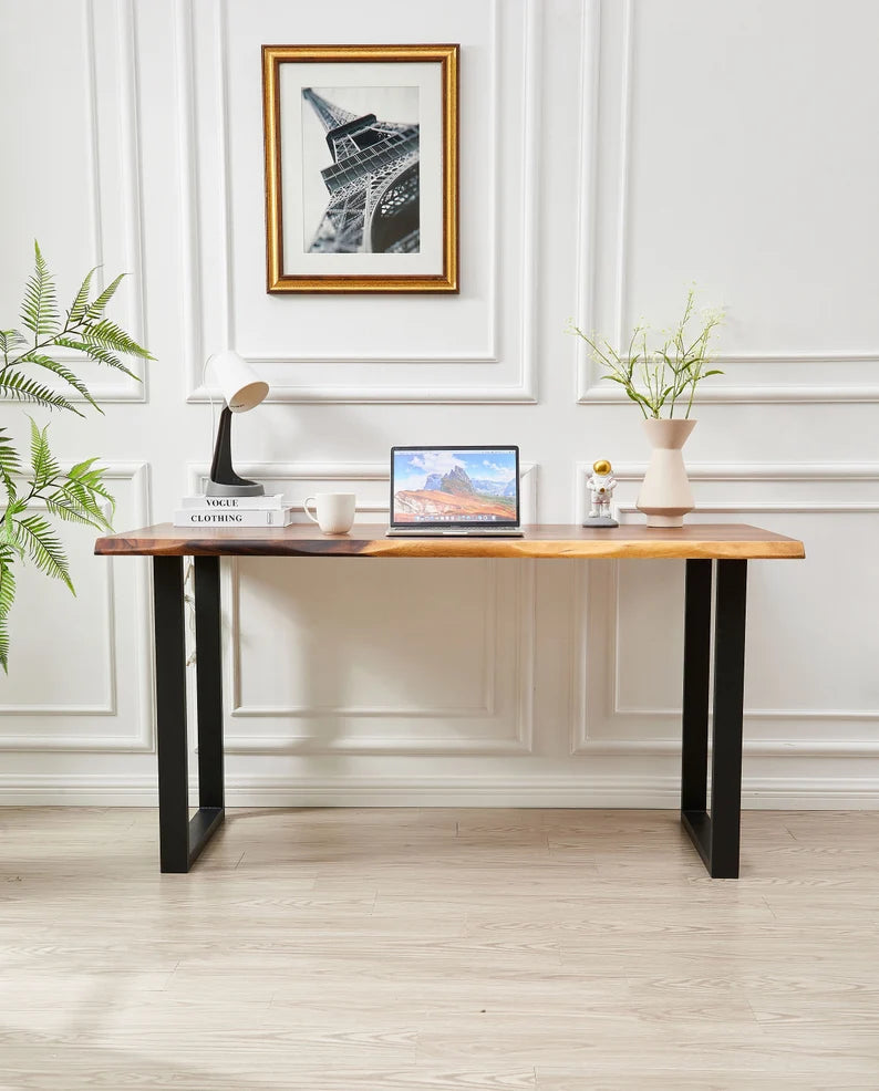 Live Edge Desk front view with black legs, laptop and decor against a paneled wall