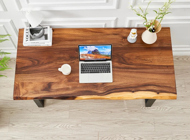 Overhead view of Live Edge Desk walnut top with laptop, mug and vase