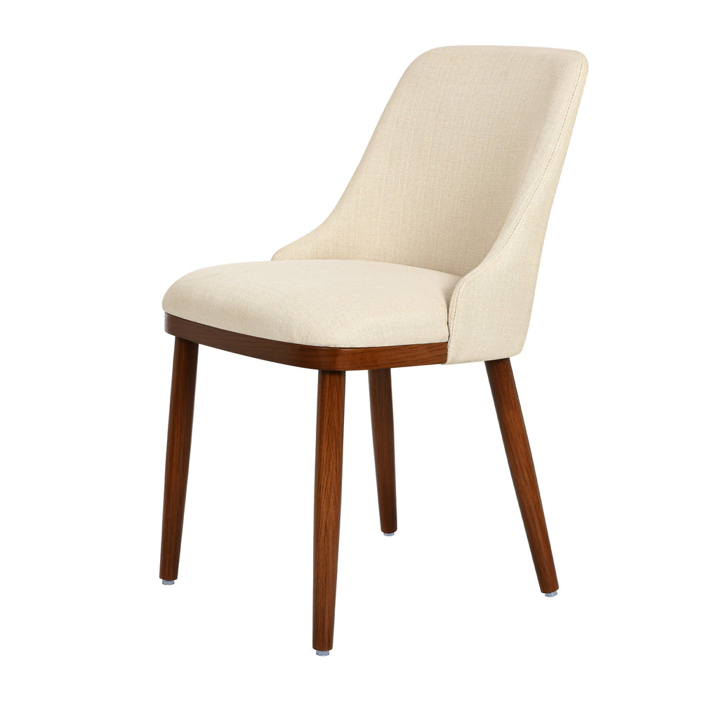 Side studio view of Modern Upholstered Dining Chair in cream fabric with tapered walnut legs
