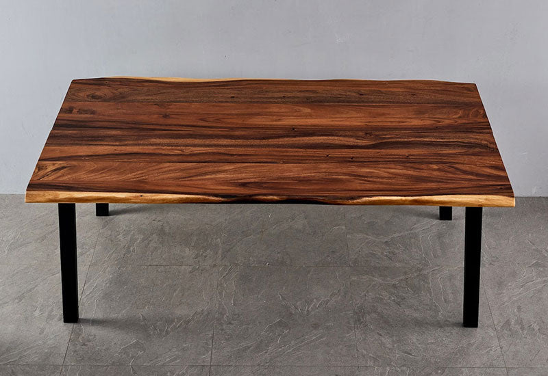 Overhead view of Live Edge Dining Table walnut top with black legs on gray tile floor