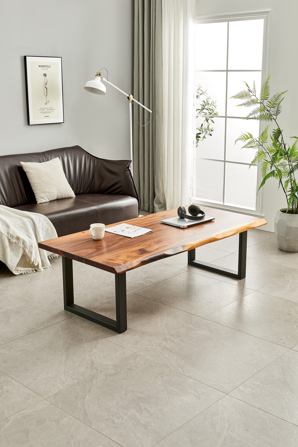 Live Edge Coffee Table styled with laptop and coffee in a living room with leather sofa