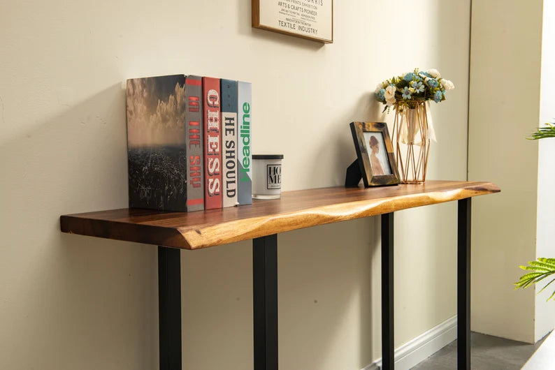 Live Edge Console Table in an entryway with books, candle and flowers