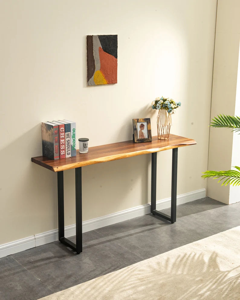Live Edge Console Table with black U-shaped legs against a cream wall with art