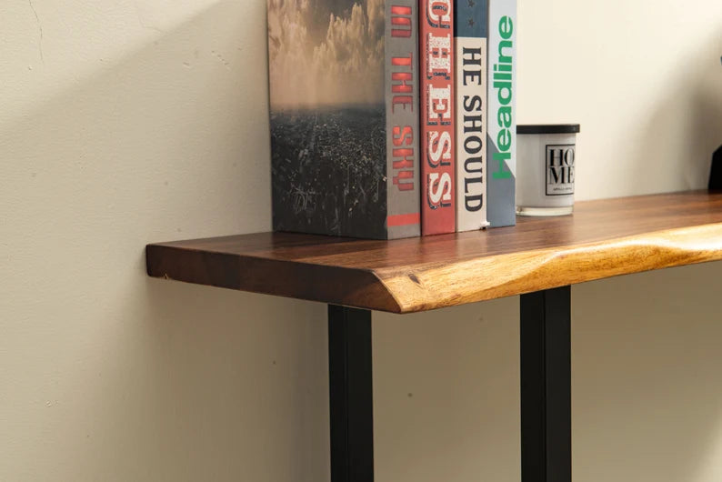 Close-up of Live Edge Console Table walnut live edge top with books