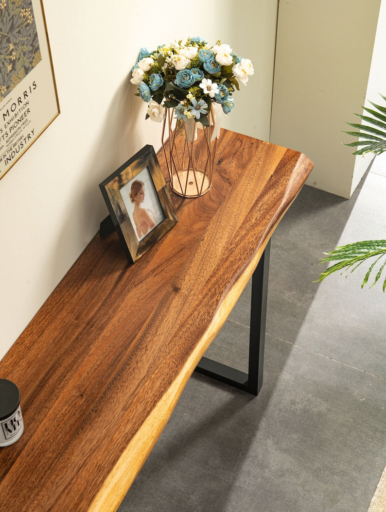 Live Edge Console Table walnut top styled with flowers and a photo frame in an entryway