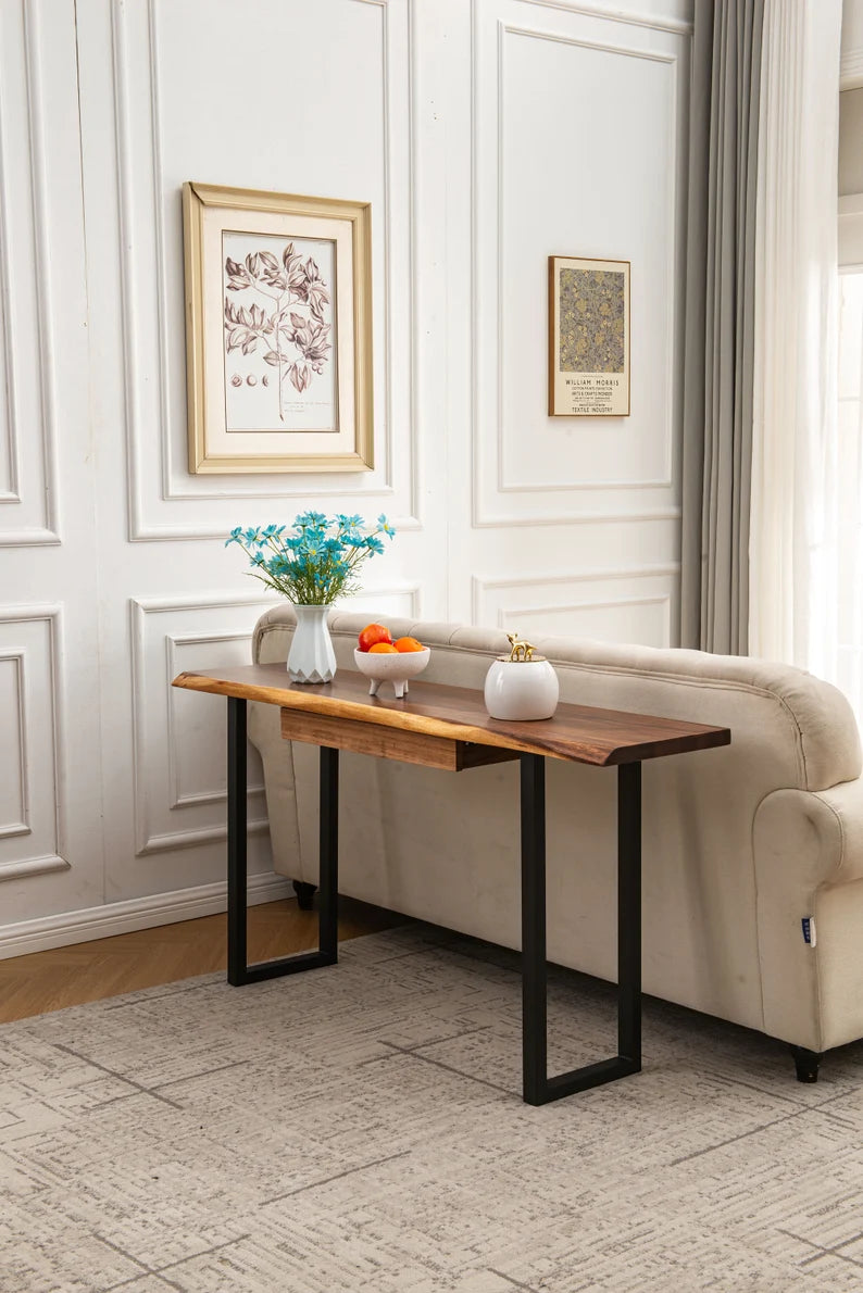 Live Edge Console Table used as a sofa table with flowers and fruit bowl