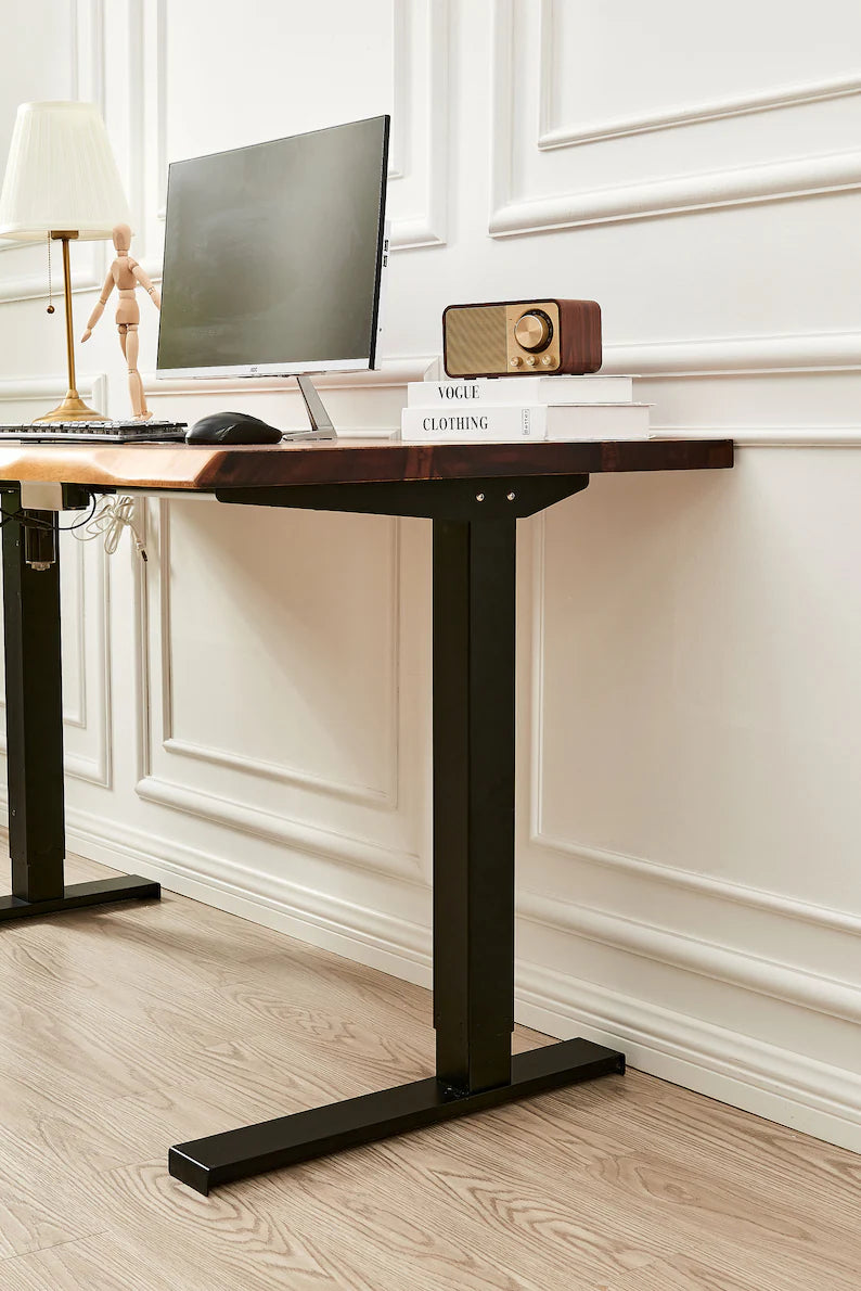 Close-up of Adjustable Standing Desk black square-tube leg and walnut top