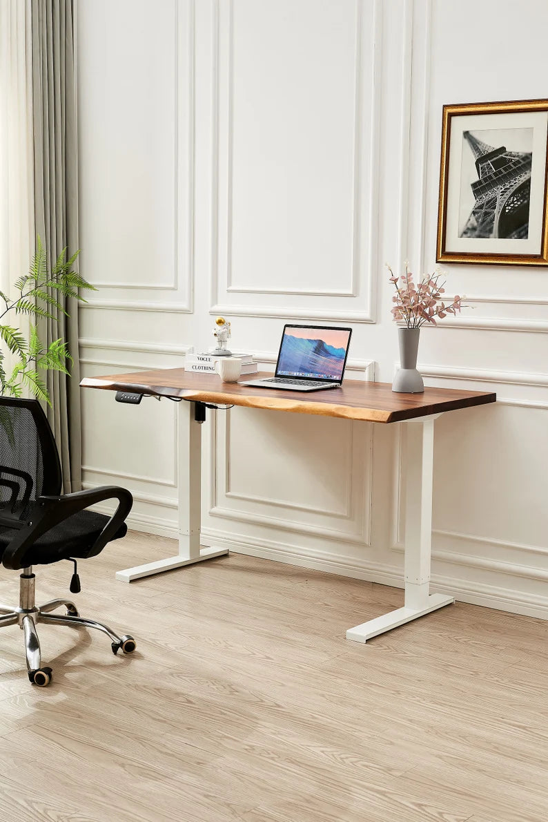 Adjustable Standing Desk in white with walnut top, laptop and office chair in a home office