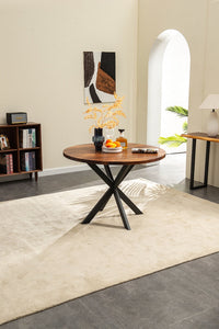 42 inch round walnut top styled in a bright dining room
