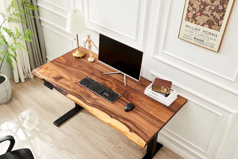 Adjustable Standing Desk black frame with walnut live edge top holding a monitor and keyboard
