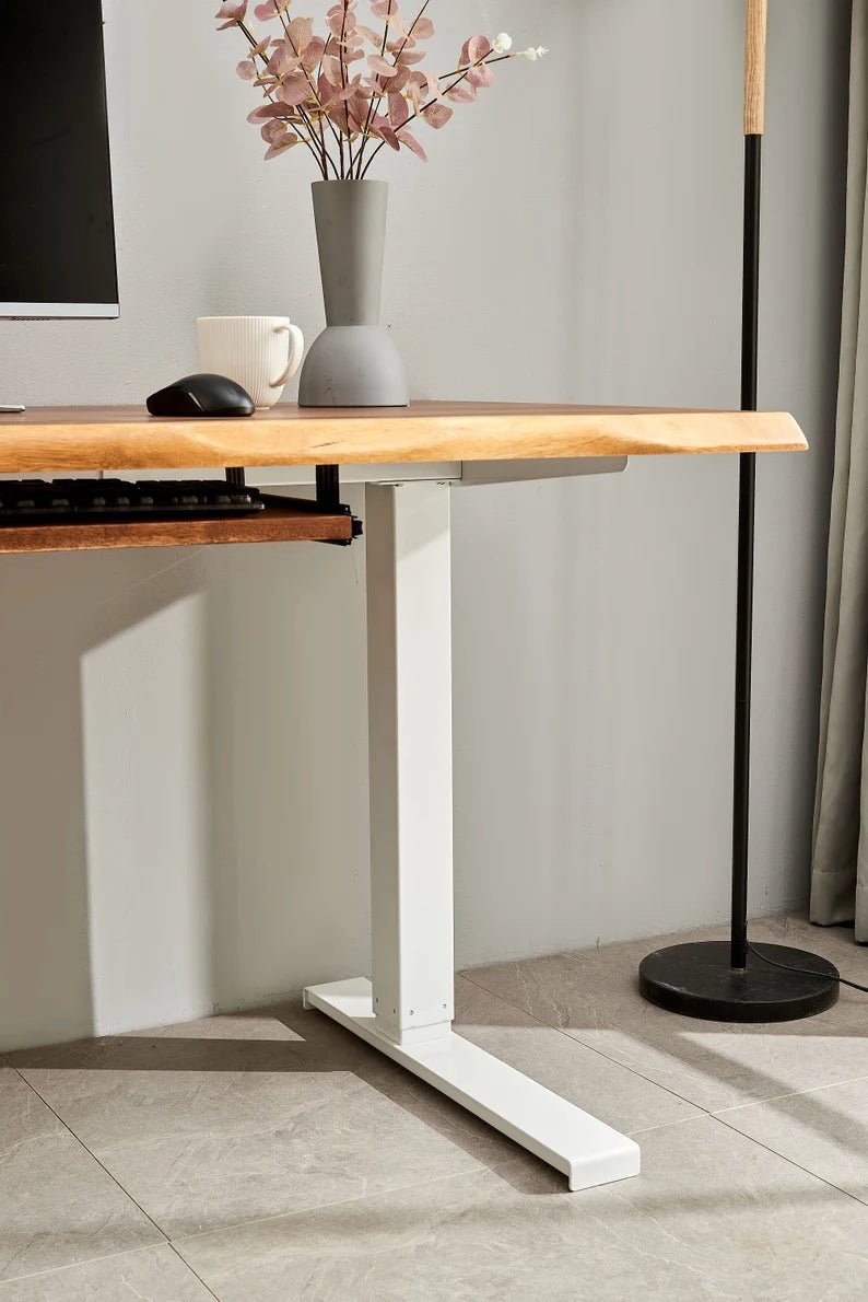 Close-up of Adjustable Standing Desk white square-tube leg and walnut top