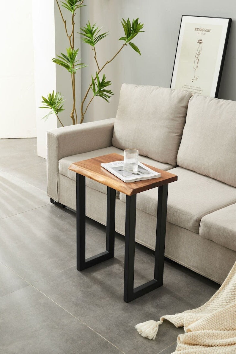 Live Edge End Table with walnut top and black U-shaped legs beside a beige sofa