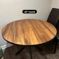 42 inch round walnut table top on a pedestal base with a dining chair