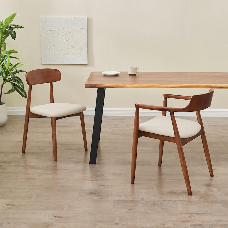 Two Modern Solid Wood Dining Chairs in walnut paired with a live edge dining table