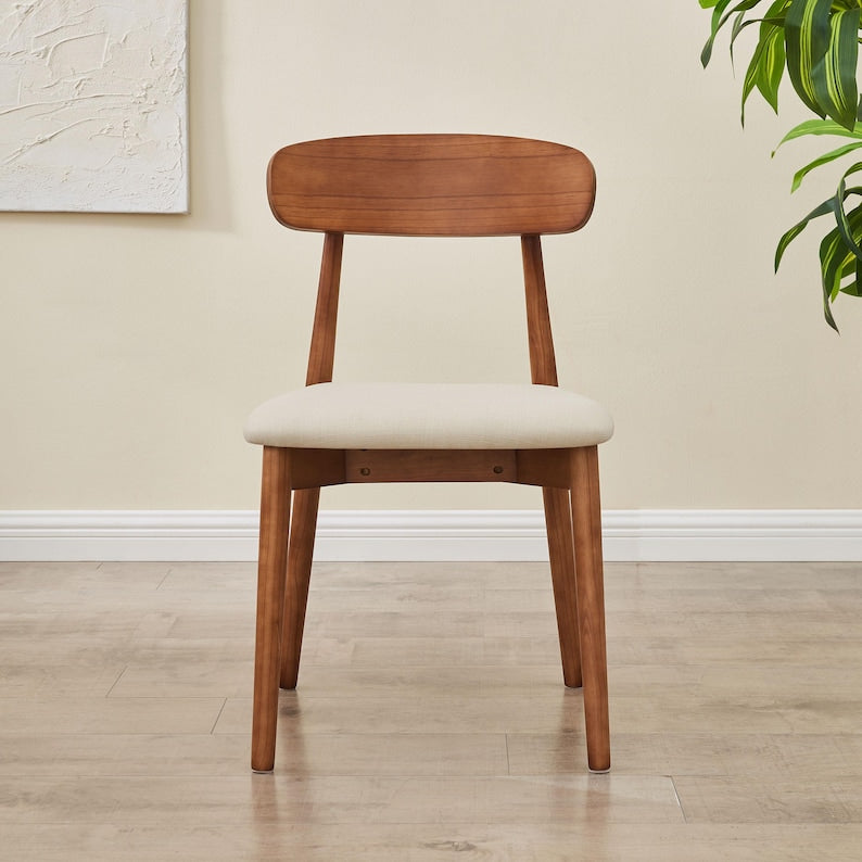 Modern Solid Wood Dining Chair in walnut with beige upholstered seat, front view in a neutral room