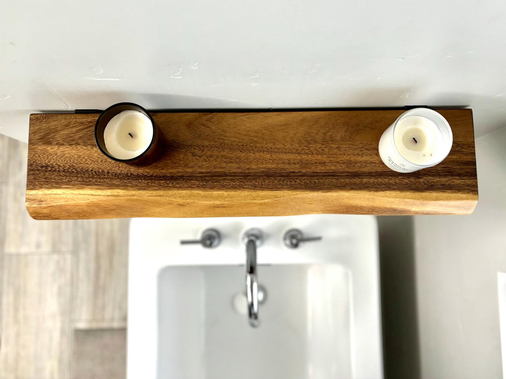No Measure Floating Shelf in live edge walnut mounted above a bathroom sink holding two candles