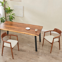 Live edge dining table with two solid wood arm chairs - overhead view