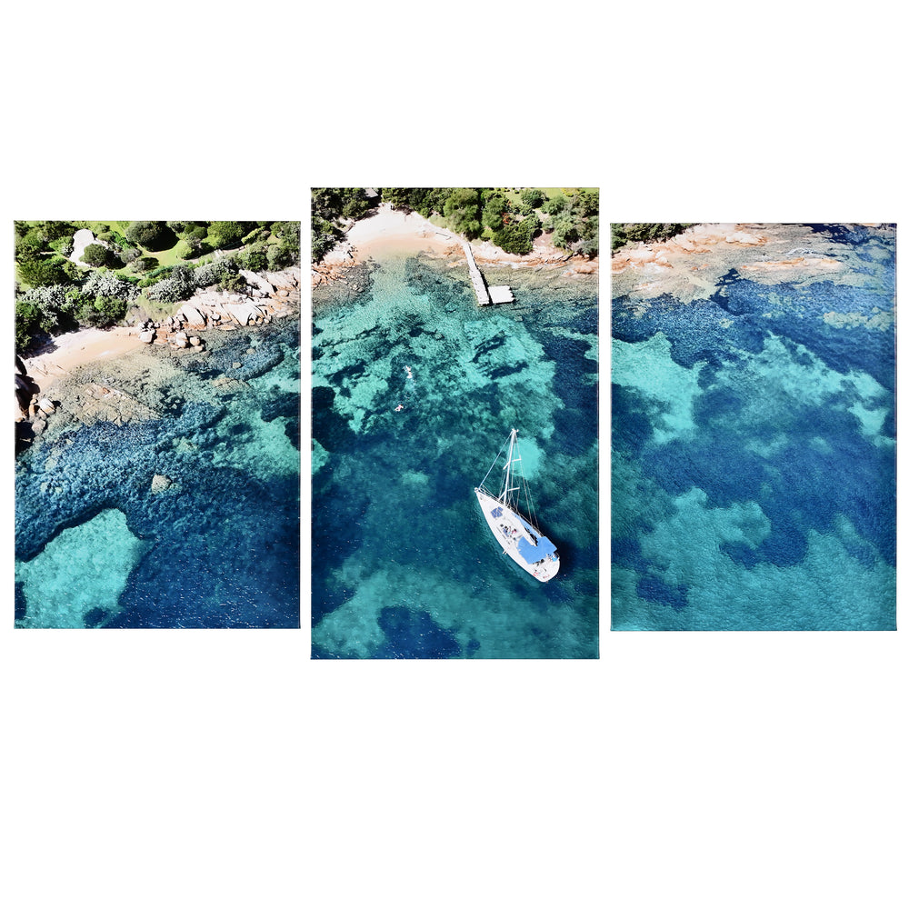 3-Panel Ocean canvas art angled view showing aerial sailboat over clear turquoise sea