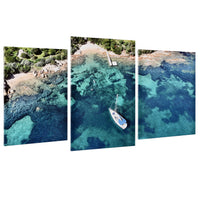 3-Panel Ocean canvas art angled floating view of a sailboat above blue and green water