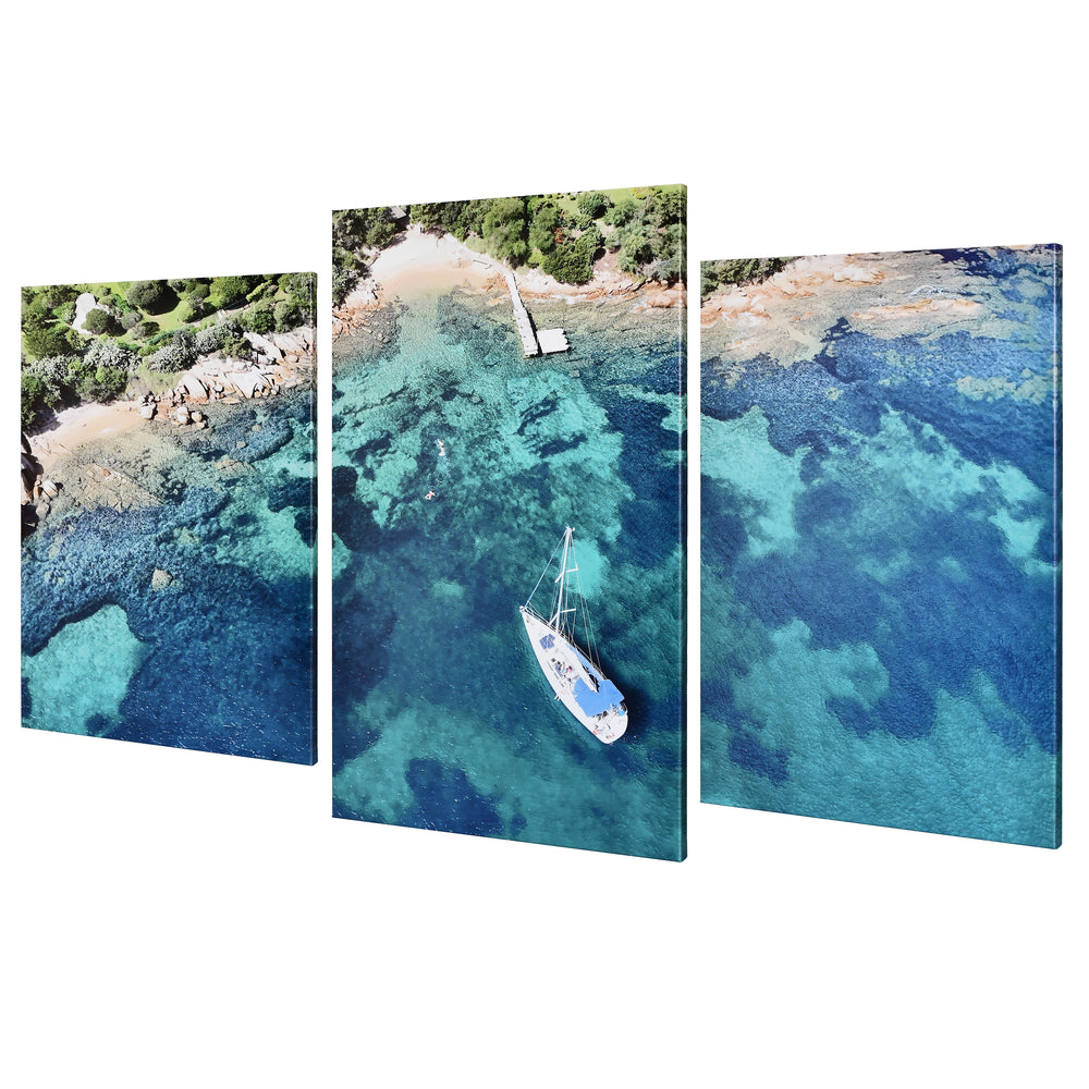 3-Panel Ocean canvas art angled view of a sailboat over turquoise water and coral reef