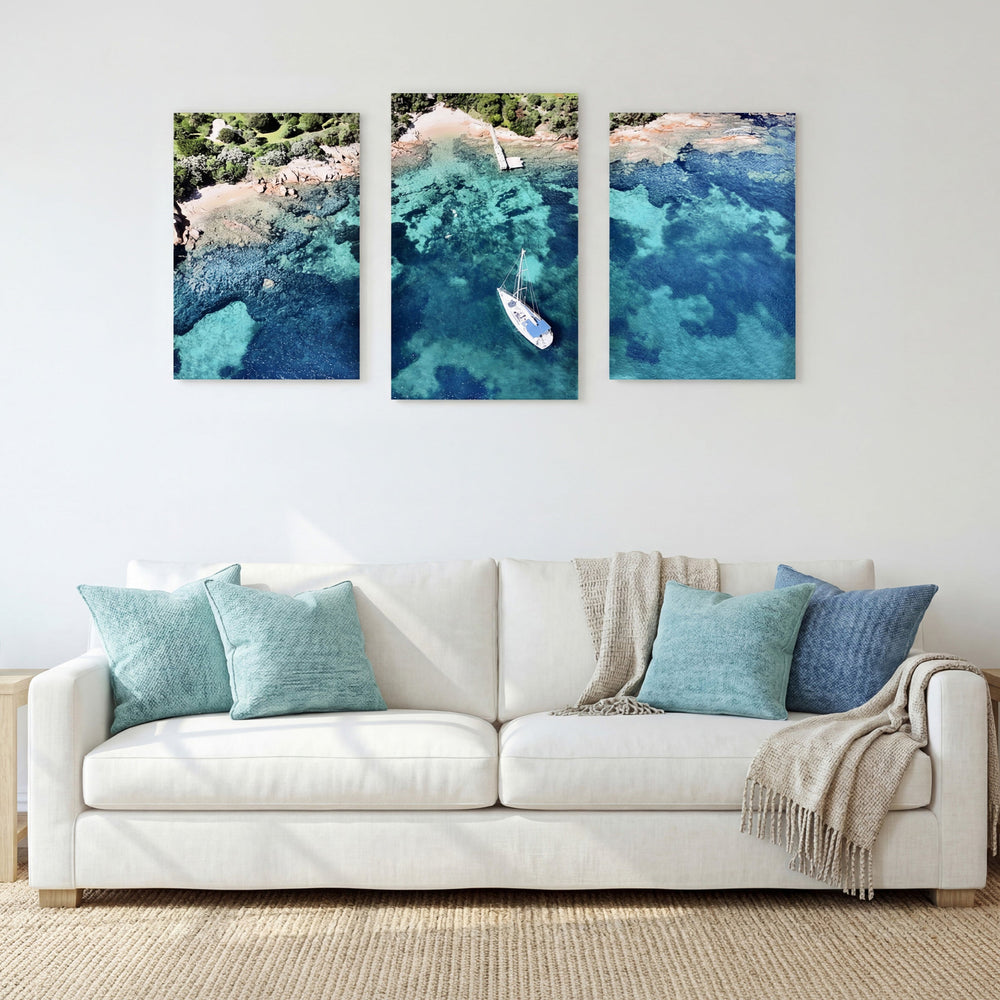 3-Panel Ocean canvas wall art above a white sofa with teal and blue pillows