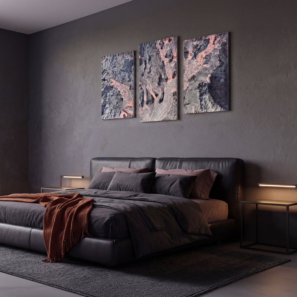 3-Panel Lava canvas wall art above a dark leather bed with rust throw in a moody bedroom